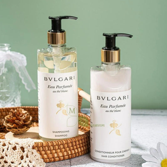 two bottles of bvlgari shampoo and conditioner.